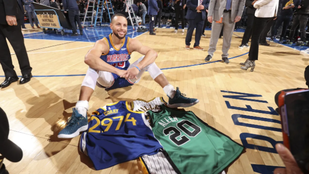 Stephen Curry seated with Ray Allen's and Reggie Miller's jerseys after remarkably exceeding the passing point of the most three pointers ever made (2,974) in the NBA (Photo: Nathaniel S. Butler) 
